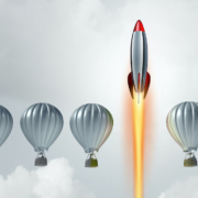 rocket ship shooting past hot air balloons representing custom websites standing out from and exceeding competition's templated websites