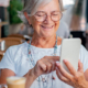 Senior Living PPC Why You Must Think Beyond Clicks Elder Woman searching on her mobile phone