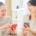 Two adult women on their phone searching for place "near me" learn more about senior living SEO.