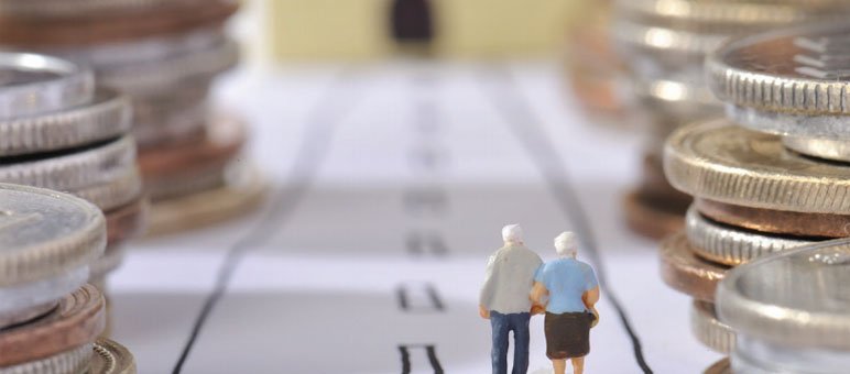 Two miniature elderly figures walk down a drawn path lined with stacks of coins, symbolizing financial planning for retirement and the importance of smart choices in senior living sales.