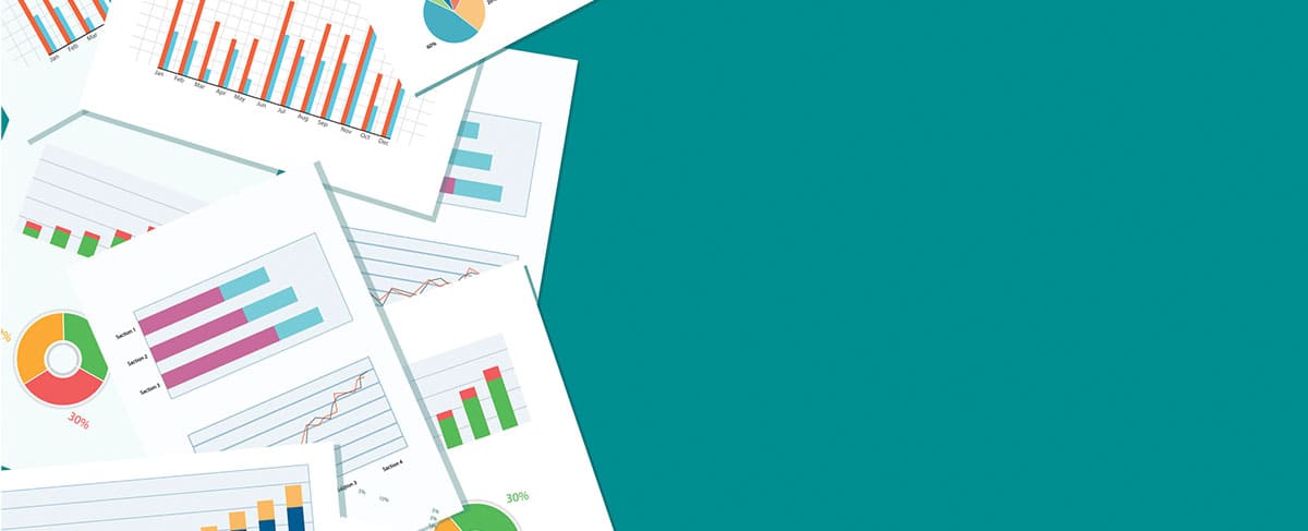 Several sheets of paper with colorful bar graphs, pie charts, and line graphs are arranged on the left side against a teal background—perfect for illustrating how to maximize your senior living marketing budget.