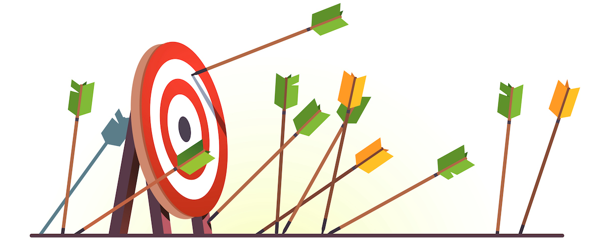 A target stands upright with one arrow hitting the bullseye, while several others scattered around it miss the center—much like senior living social media marketing, where focused strategies achieve standout results.