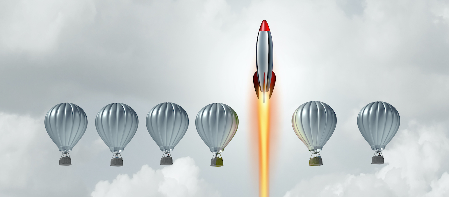 A rocket launching upward between rows of six hot air balloons, floating among clouds like icons on senior living websites.