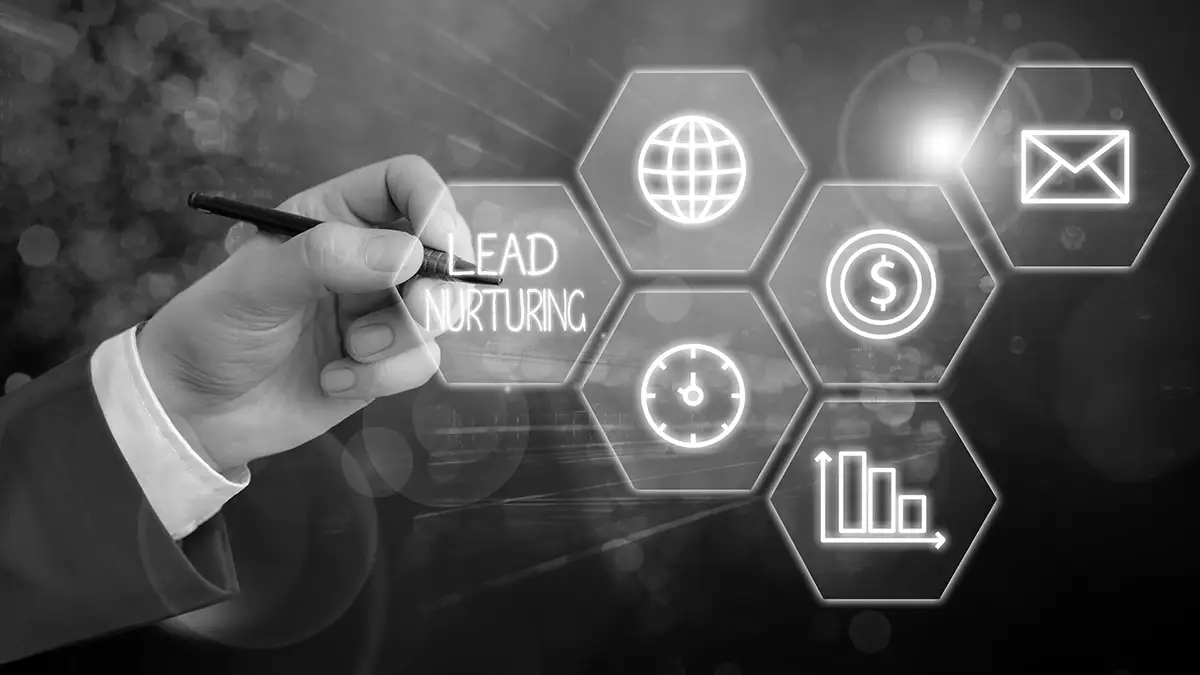 A hand holding a pen points to a digital hexagonal grid with icons for global, mail, money, clock, chart, and the words "LEAD NURTURING" highlighted.