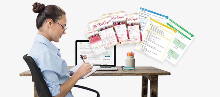 A woman sits at a desk taking notes with a laptop in front of her and various printed worksheets and colorful documents displayed nearby, preparing materials for senior living marketing agencies.