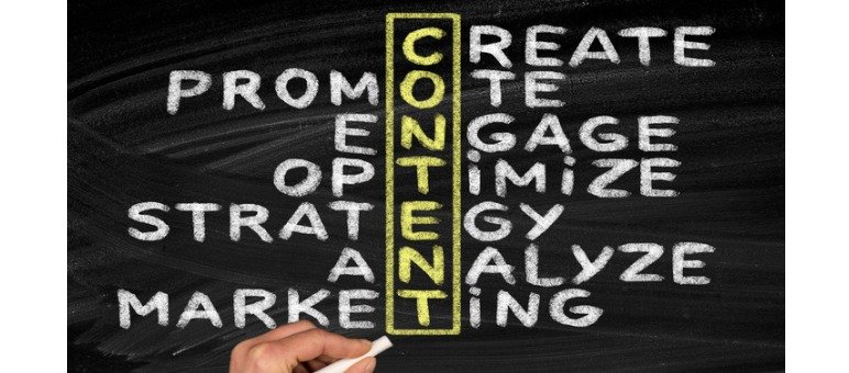 A hand writes on a chalkboard showing the word "CONTENT" vertically, intersecting words like promote, create, engage—even analyze—for a senior living blog focused on effective content marketing strategies.