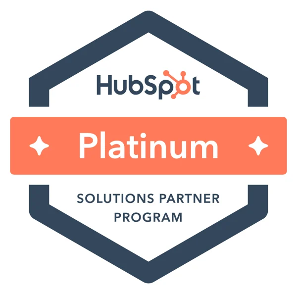 Hexagonal badge with "HubSpot Platinum Solutions Partner Program" text, featuring the HubSpot logo at the top and a coral-colored banner across the center.