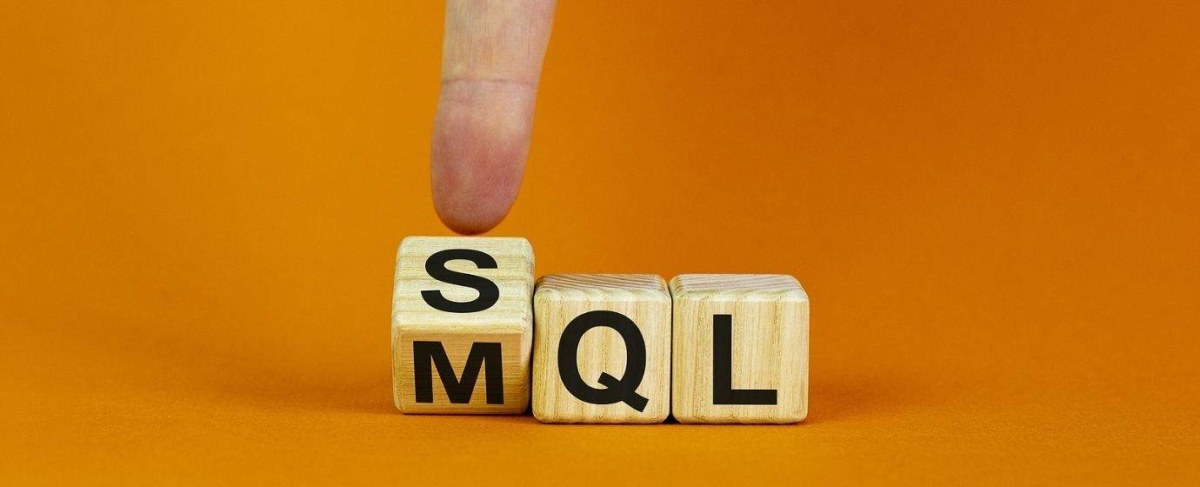 A finger points to a wooden block with the letter "S" next to blocks labeled "MQL," symbolizing senior living leads on an orange background.