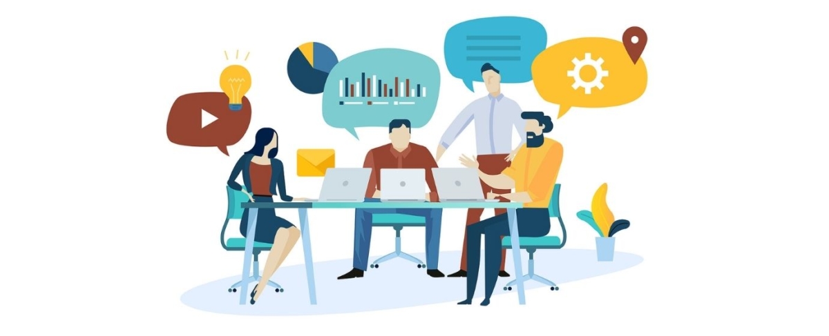 Four people sit at a table with laptops, discussing senior living sales strategies, their ideas illustrated by colorful icons and charts in speech bubbles floating around them.